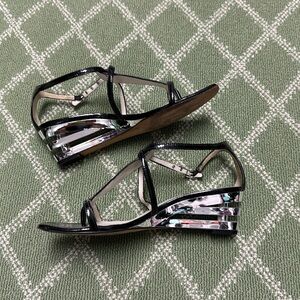 Stunning black & silver sandal with chic design!  Heel is an open stack look!